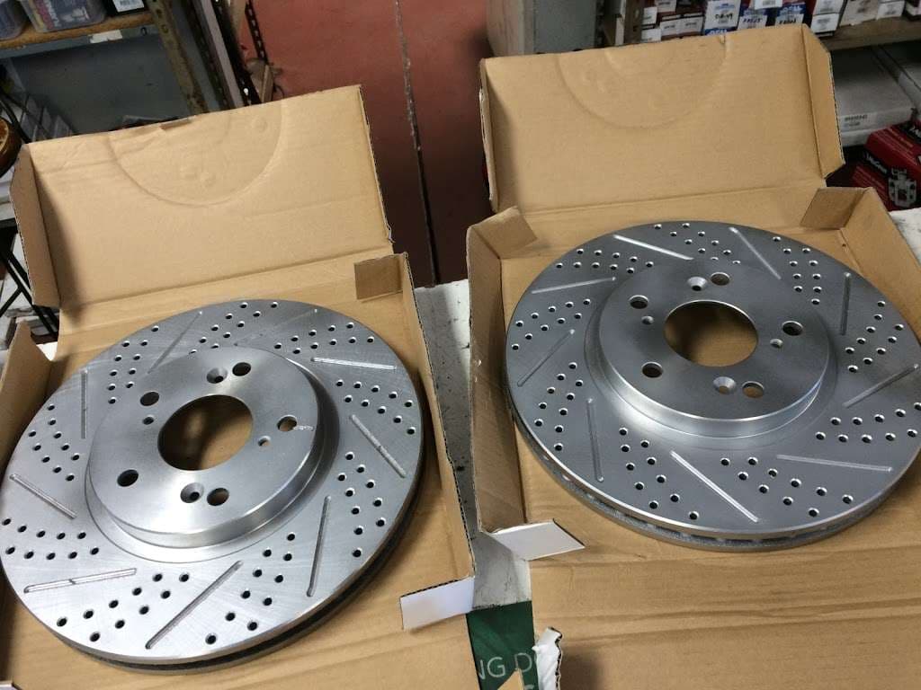 Pair of custom drilled brake rotors boxed and ready inside ACR Auto Parts